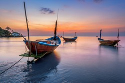 Fishing Boats on the Beach at sunset