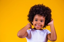 Beauty portrait of little afro girl with afro hairstyle. Adorable little girl with blackpower hair