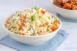 Chinese Vegetable Fried Rice in a Bowl with Side Dish  on White Background.