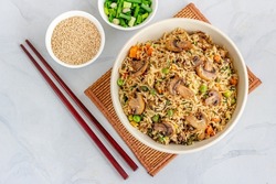 Chinese Vegetable and Mushroom Fried Rice with Sesame Seeds and Scallion Top Down Asian Food Photo