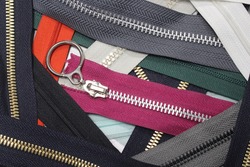 Collection of zippers of different colors and variants in the textile industry