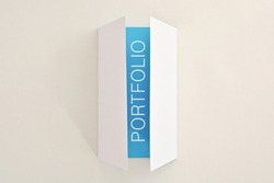 Template of   white folded card with   blue page with word Portfolio