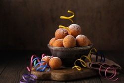 Castagnole or Favette or Frittelle or Frittole is an Italian fried doughnut. Donut Holes fried in oil until golden brown and sprinkled with sugar. Homemade. Carnival food.