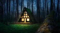 A frame triangle holiday house in the woods at night, peaceful weekend getaway in nature