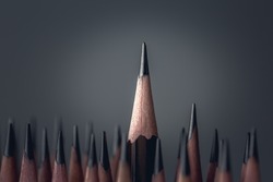 One pencil standing out from the group of other pencil.Leadership and growth in business concept.