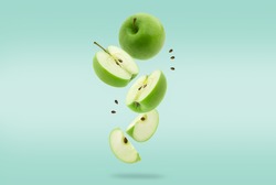 Stack of green Apple falling or flying.Creative levitation food