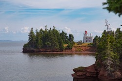 Blockhouse Point Lighthouse, located on Rocky Point on the west side of the Charlottetown Harbour entrance, Prince Edward Island, Canada  A historic building 