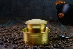 Filter coffee served in a brass cup