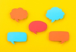 Speech bubbles arranged on a yellow background