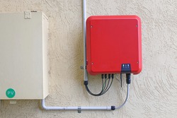 Solar inverter next to a meter box