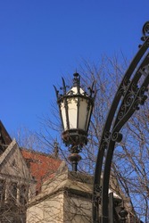 Classic wrought iron vintage street light standing on The University of Chicago campus.