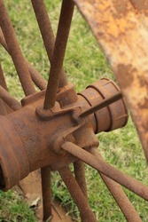 Vintage wagon rusty wheel from a traditional farm tractor.