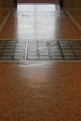 Vintage square tile glass flooring to allow for light transmission thru the floor.