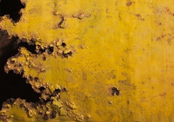 Black and yellow painted old grungy corroded weathered Metal sheet surface texture background. Space for text, title.
