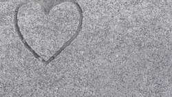 Free formed heart shape in concrete pavement. Copy space for text, title