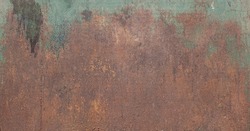 Old rusty galvanized metal sheet. Blue patina and rust. Grunge background texture. Copy space.