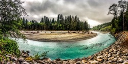 Panorama of a mountain river in the forest. Forest river panoramic landscape. Forest river panorama. River bend in forest