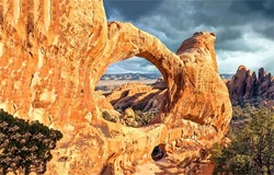 In the canyon of the red rocks. Arch canyon in desert. Red rock canyon scene. Red rock canyon arch