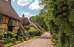 Houses on the street in an English village. British village scene. Village in England. Countryside english village