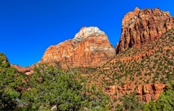 Rocks of the red canyon. Canyon red rocks on blue sky background. Red rock canyon scene. Red rocks in canyon desert