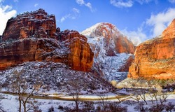 Rocks of the red canyon in the snow. Snow in red rock canyon. Snowy canyon red rocks. Red rock canyon in snow landscape