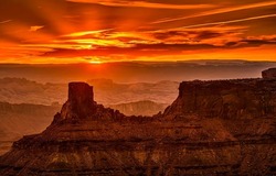 Martian sunset over the canyon. Canyon at sunset. Red sunset in red rock canyon. Beautiful sunset in red rock canyon