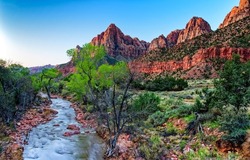 A stream in the desert of the canyon. Red rock canyon river stream River stream in canyon. Canyon river stream landscape