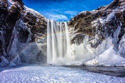Mountain Seljalandsfoss waterfall in winter snow