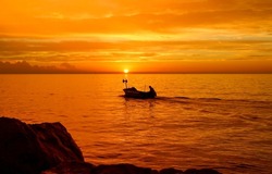 Boat at sea at sunset. Sunset boat on water