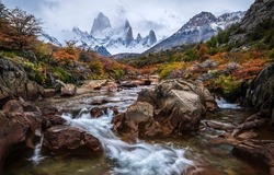 River valley in the mountains. Autumn mountain river stream. River stream in mountain valley. Mountain river valley landscape