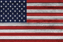 United States flag painted on wooden plank texture background.