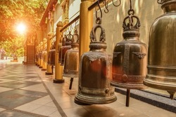 Brass praying bells hanging in Buddhist Temple