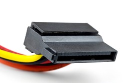 A 15 contacts serial ATA plug for powering a hard disk or CD drive coming from a computer power supply, isolated on a white background.
