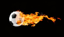 Flying football or soccer ball on fire. Isolated on black background.
