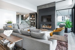 Luxurious and elegant living room with slate and dark yellow tones