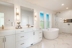 Clean and simple white bathroom washroom restroom freestanding bathtub colorful windows faucets glass wall shower