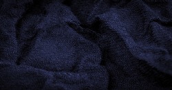 Coarse dark blue woolen fabric. Sheep with long, durable, coarse-fiber wool especially suited to your design. As with various large breeds of lamb. Texture background pattern