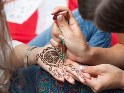 Woman applying henna