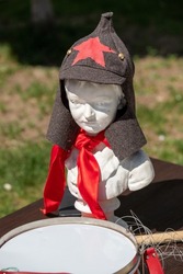 Budyonovka on a mannequin, a drum and a red tie, a symbol of the pioneers.