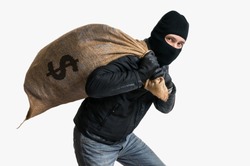 Thief robbed bank and is carrying full bag of money. Isolated on white background.