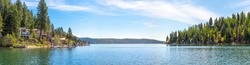 A panoramic view of Lake Coeur d'Alene, Idaho, USA with waterfront homes, docks and marina at Rockford Bay.	