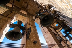 The bells of the Giralda Tower seen up close at the Great Cathedral of Seville, Spain.