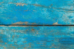 Old boards covered with blue paint. Texture background of wood. Shabby wooden surface.