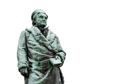 Historic statue of Carl Friedrich Gauss at his birthplace in Braunschweig, Lower Saxony, Germany. Famous mathematician and physicist (1777-1855), isolated on white background with copy space.