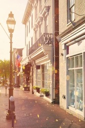 Romantic stroll on Main Street in historic downtown Annapolis, Maryland, USA. Typical picturesque architecture in the capital city of Maryland.                               
