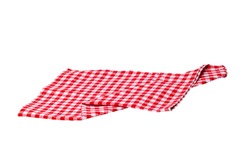 Towels isolated. Close-up of red and white checkered napkin or picnic tablecloth texture isolated on a white background. Kitchen towel.