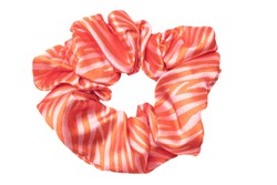 Fashionable hair band. Close-up of an gold orange striped silk scrunchy for ponytail hairstyle isolated on a white background. Accessories for woman or girl.