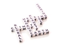 global climate change with planet warming and ice melting words in shape of white cubes with black letters on white background