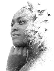 The concept of the freedom depicted in a Double Exposure portrait of young African American woman. Paintography
