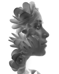 A double exposure portrait of a pretty woman combined with 3d flowers.